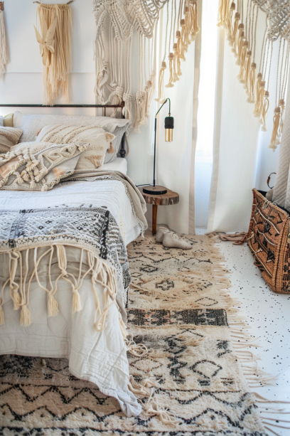 boho bedroom decor, layered rugs, textured bedding, macramé