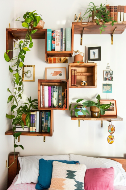 small bedroom, wall-mounted shelves, space-saving design, books, plants, natural light, cozy interior