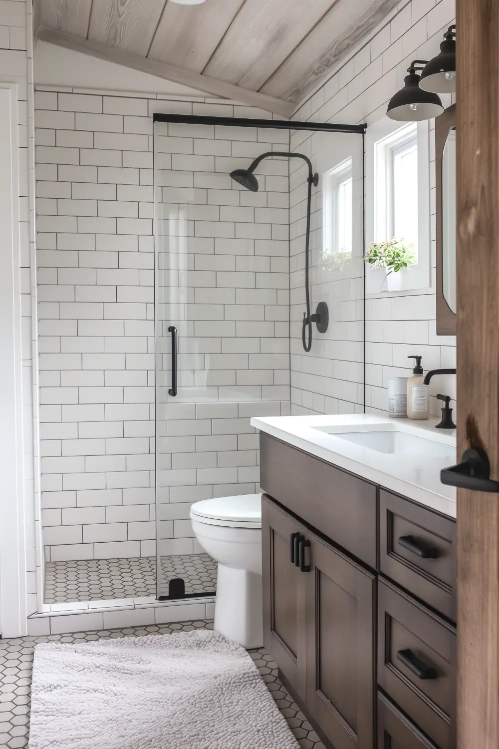 Chic small bathroom with curbless shower and natural stone tiles, stylish floating vanity.