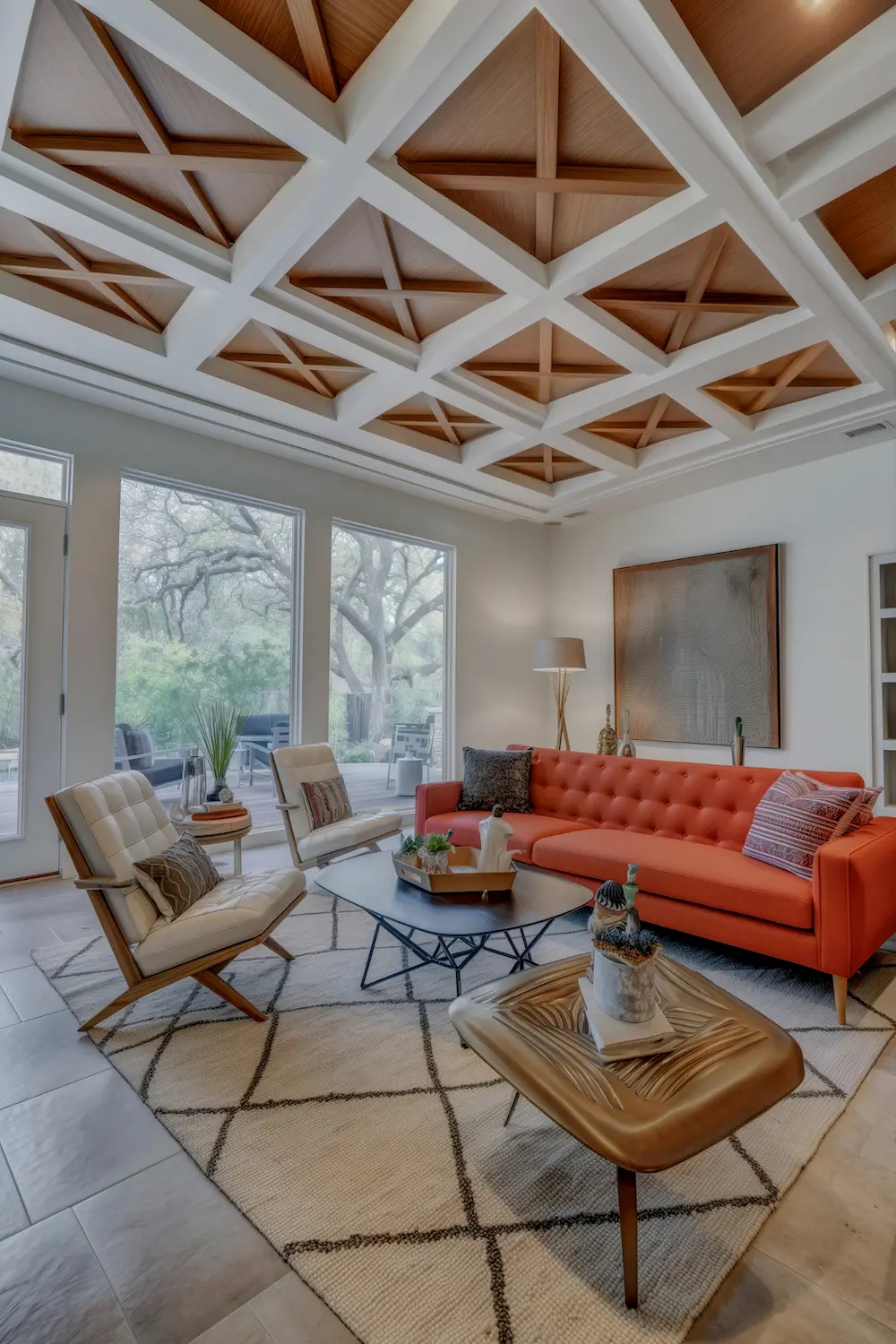 Modern living room showcasing dramatic diamond-shaped ceiling panels with stylish mid-century decor.