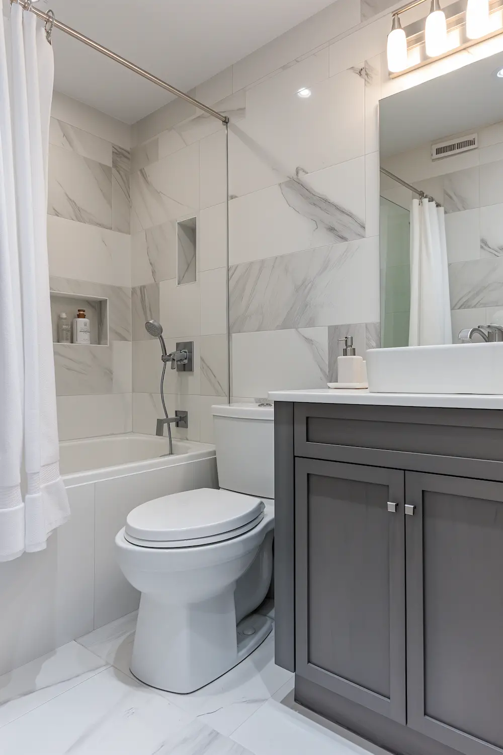 Stylish bathroom with marble tile walls white shower curtain and modern gray vanity